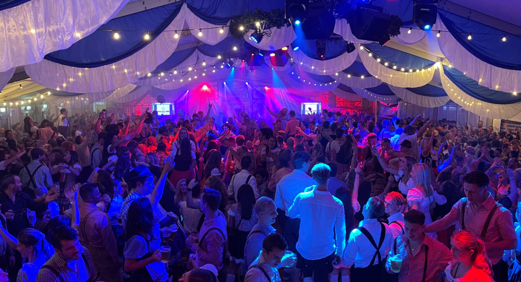 Die hard fans. Rearview of a crowd at a music gig with their han