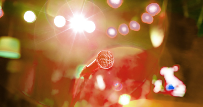 Die hard fans. Rearview of a crowd at a music gig with their han